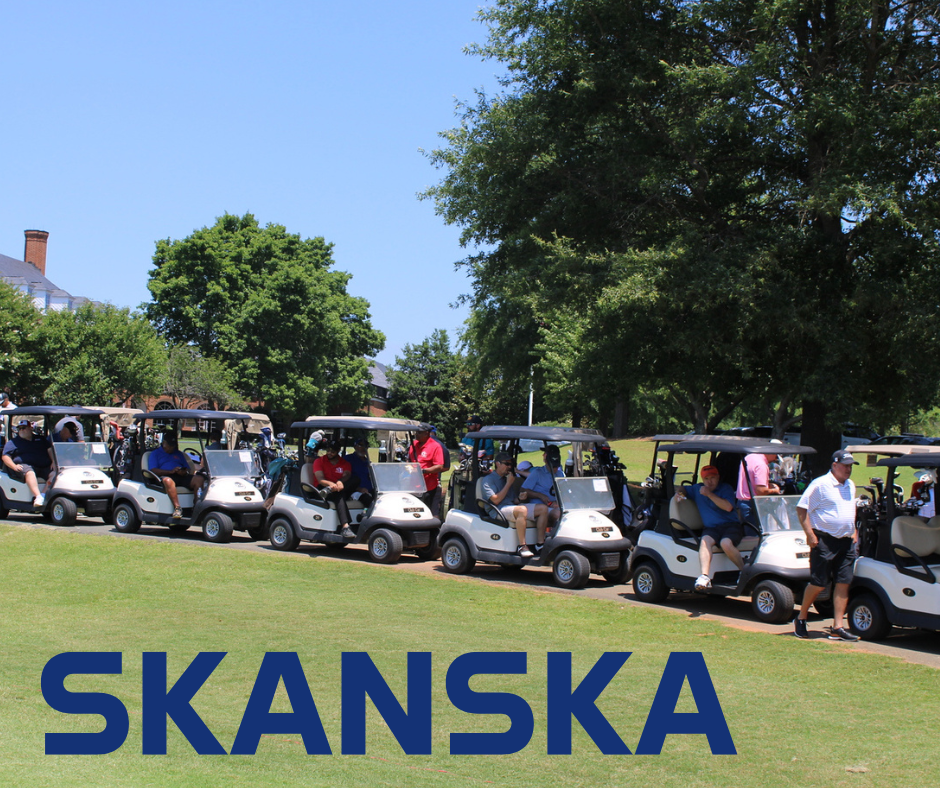 golf carts lining up at a golf course; skanska logo